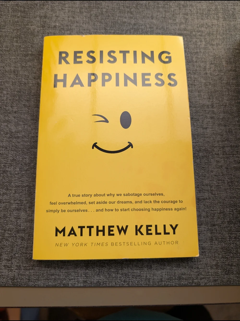 Resisting Happiness by Matthew Kelly - Yellow Paperback